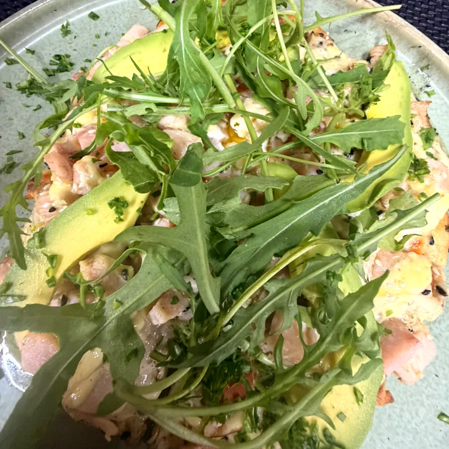 The Loaded Hen flatbread piled with smoked chicken, avocado and rocket